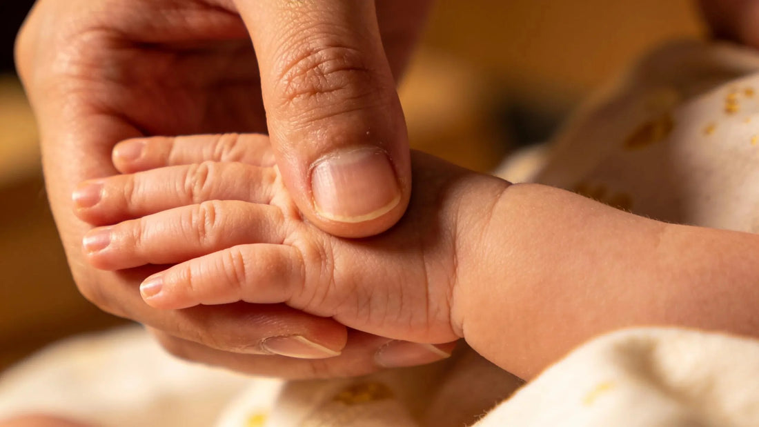 Newborn handprints captured by parents, showcasing the beauty of early parenthood and the importance of timing in keepsakes