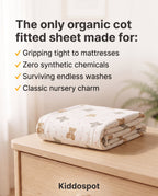 Kiddospot's organic cotton fitted sheet folded on a nursery table.