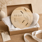 Kiddospot wooden baby announcement board keepsake with hospital band slots, accompanied by a tag and ribbon.
