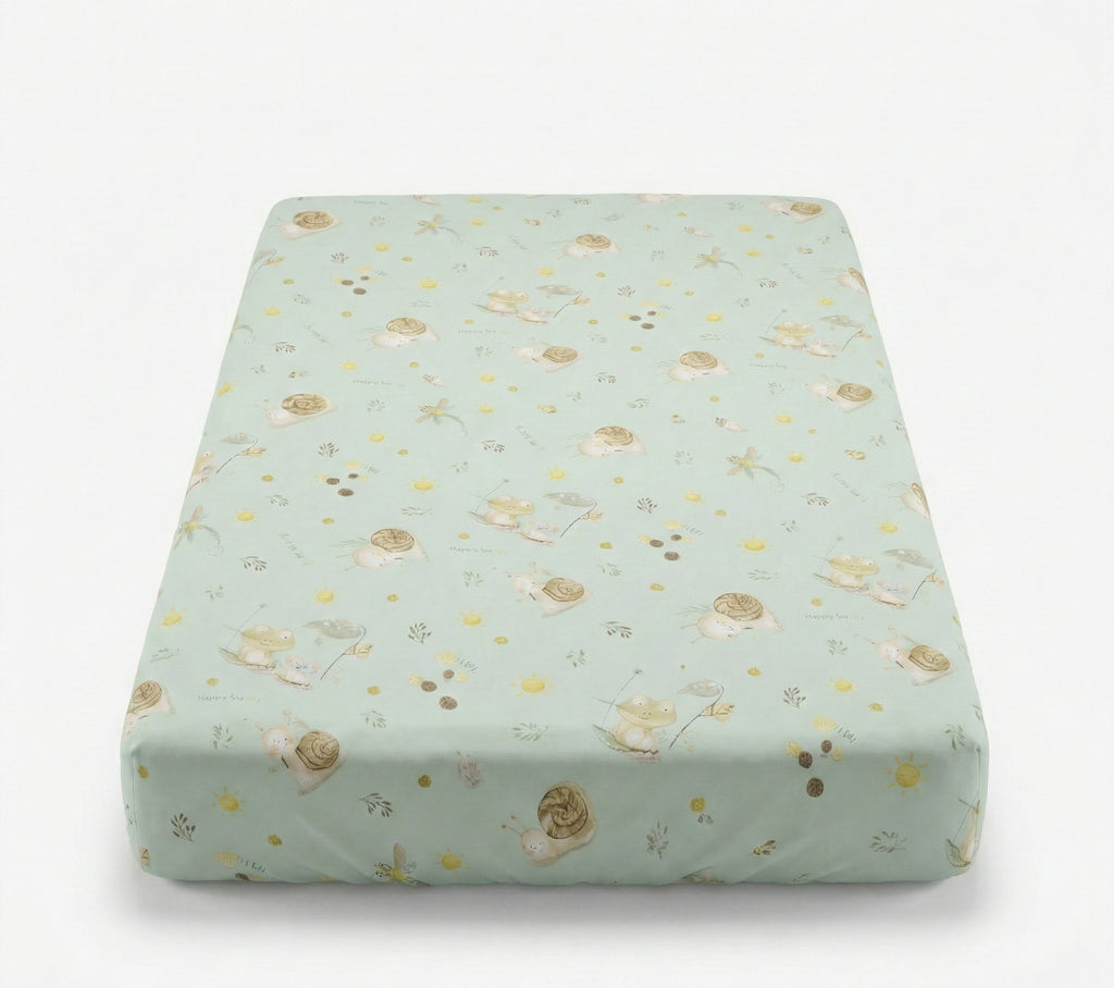 Floral-patterned mattress cover on a light green background