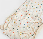 Baby blanket with colorful heart pattern on a white background