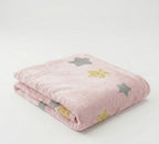 Pink blanket with star patterns on a white background