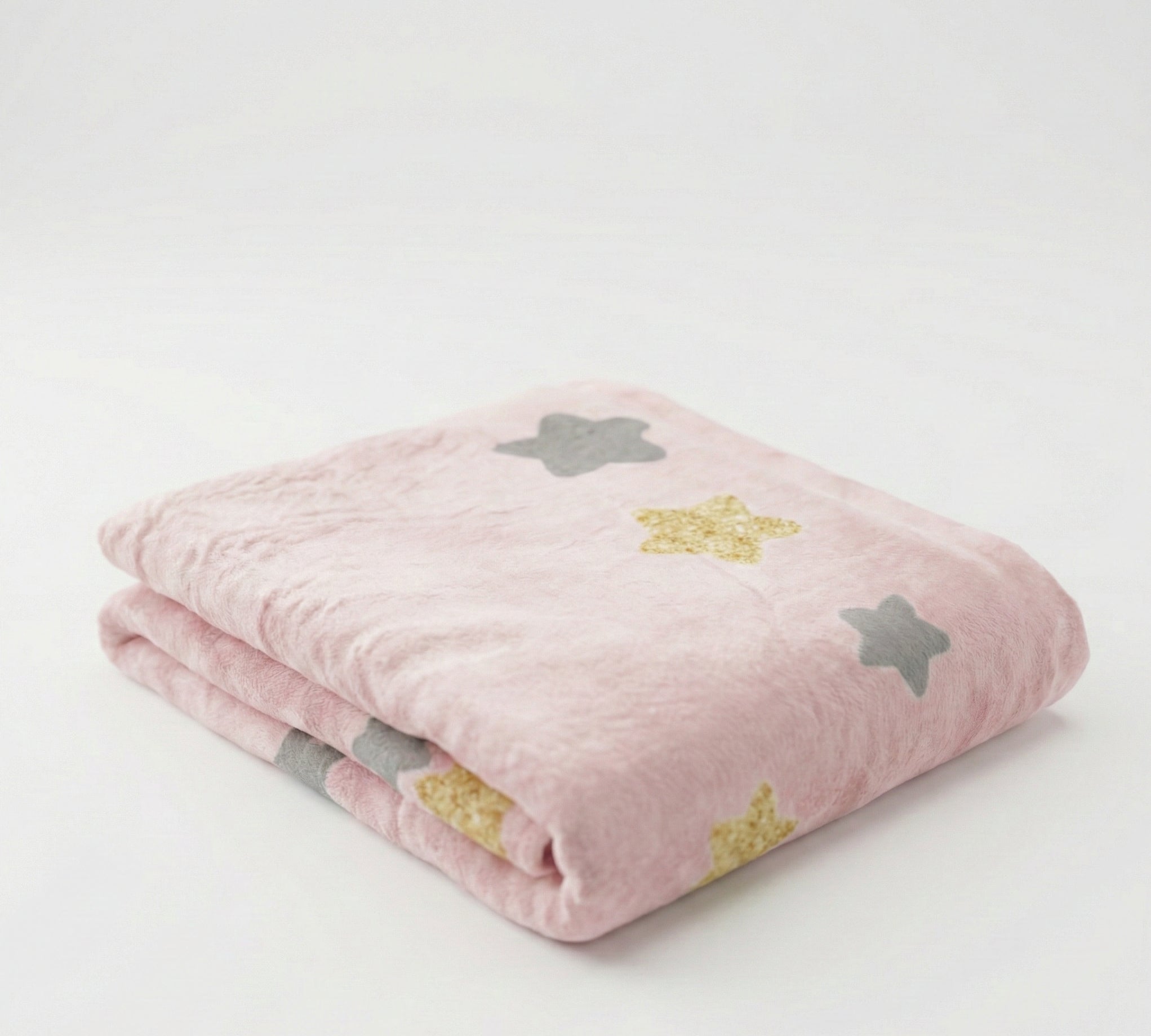 Pink blanket with star patterns on a white background