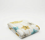 Folded baby blanket with star patterns and numbers on a white background