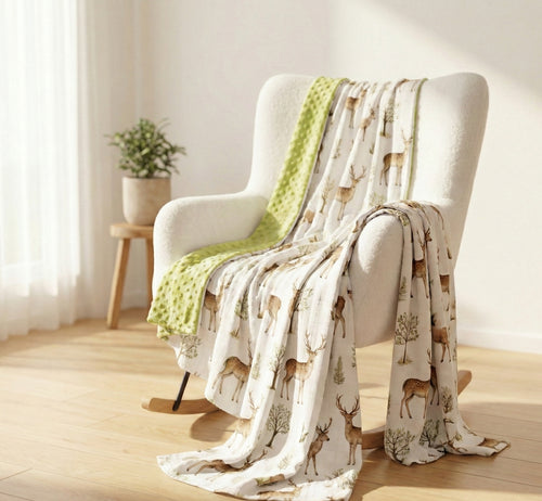 Chair with a Kiddospot blanket featuring deer pattern in a bright room