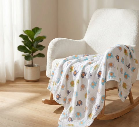 Kiddospot organic muslin swaddle elephant print on rocking chair — GOTS certified