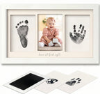 Baby hand and foot print frame with photo of a baby and ink pads.