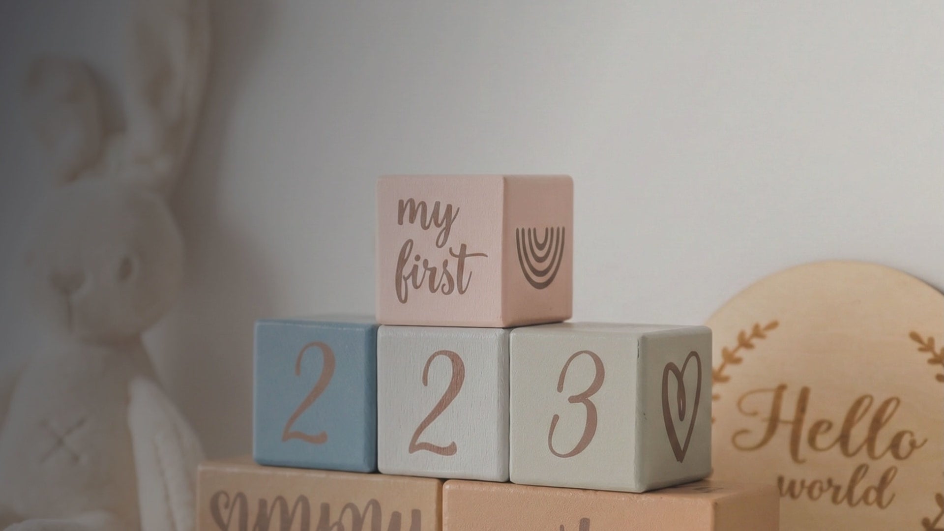 Kiddospot Blue Wooden Baby Milestone Blocks — set of 6 matte-painted solid wood blocks in muted boho tones of dusty rose, powder blue, sage green, stone grey and warm tan. Dark brown handwritten-style cursive text tracks months, weeks, days and special occasions including firsts and milestones. Perfect monthly baby photo prop and baby shower gift. Free AU shipping. kiddospot.com