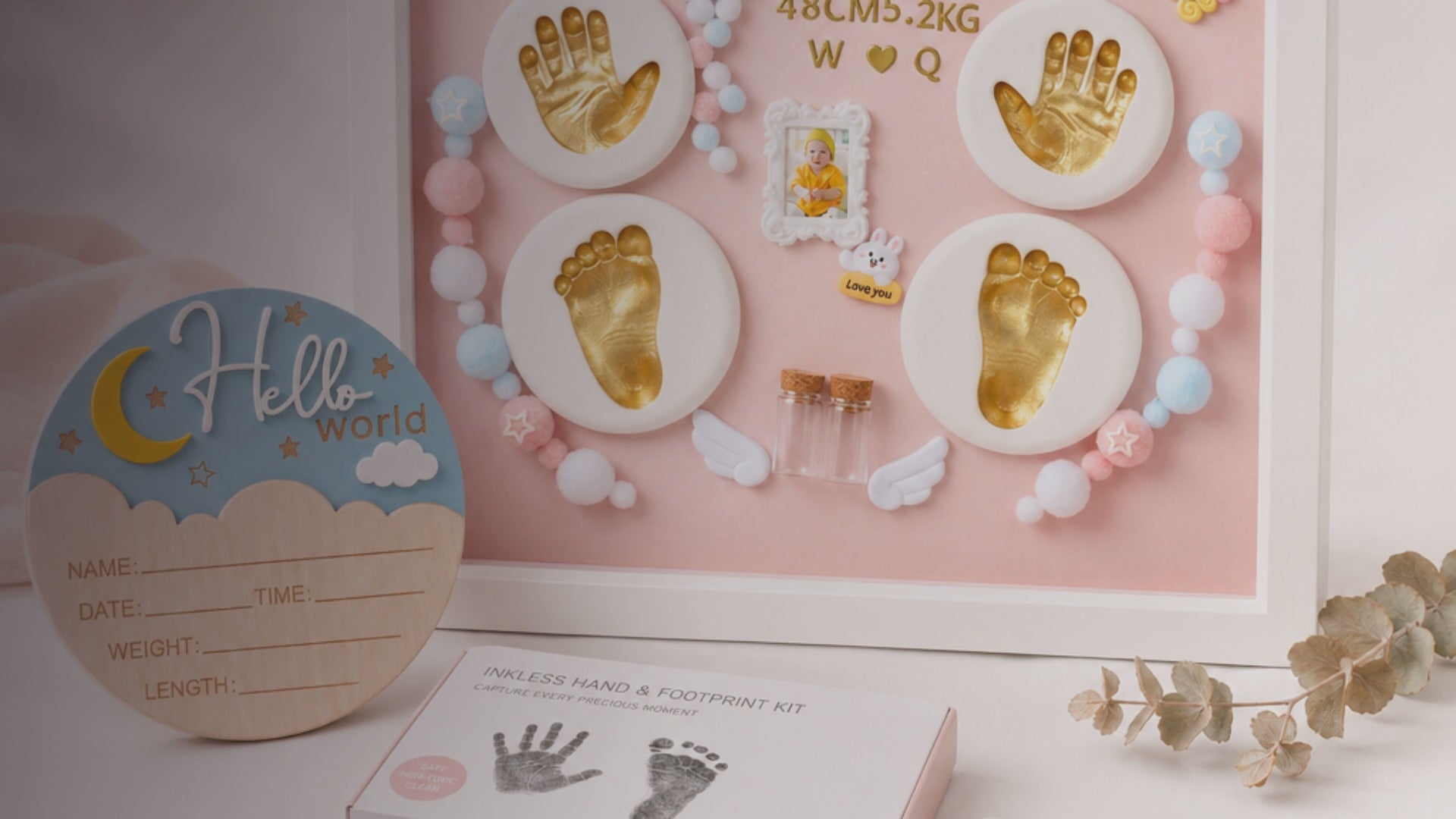 Kiddospot Newborn Keepsake Bundle Pink — includes 28x33cm pink baby handprint and footprint shadowbox frame with hanging hardware, newborn mess-free inkless hand and footprint kit safe for newborn skin from day one, and wooden Hello World birth announcement sign. Complete newborn keepsake gift set for girls, ISO 8124 certified, arrives gift-boxed. Free AU shipping. kiddospot.com