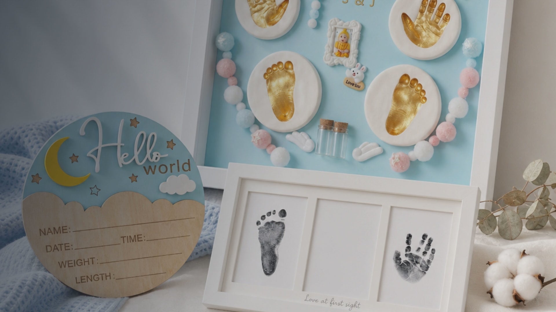 Kiddospot Newborn Keepsake Bundle Blue — includes 28x33cm blue baby handprint and footprint shadowbox frame with hanging hardware, newborn mess-free inkless hand and footprint kit safe for newborn skin from day one, and wooden Hello World birth announcement sign. Complete newborn keepsake gift set, ISO 8124 certified, arrives gift-boxed. Free AU shipping. kiddospot.com