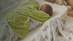 Kiddospot Deer Minky Baby Blanket and Muslin Swaddle Set — two-piece matching newborn gift set featuring a watercolour woodland deer print in taupe on off-white, with sage green circular trees and black branch details. Ultra-plush sage green dimple minky reverse plus lightweight breathable muslin swaddle. Gender-neutral woodland design suited to boho, Scandi and nature nurseries. Free AU shipping. kiddospot.com