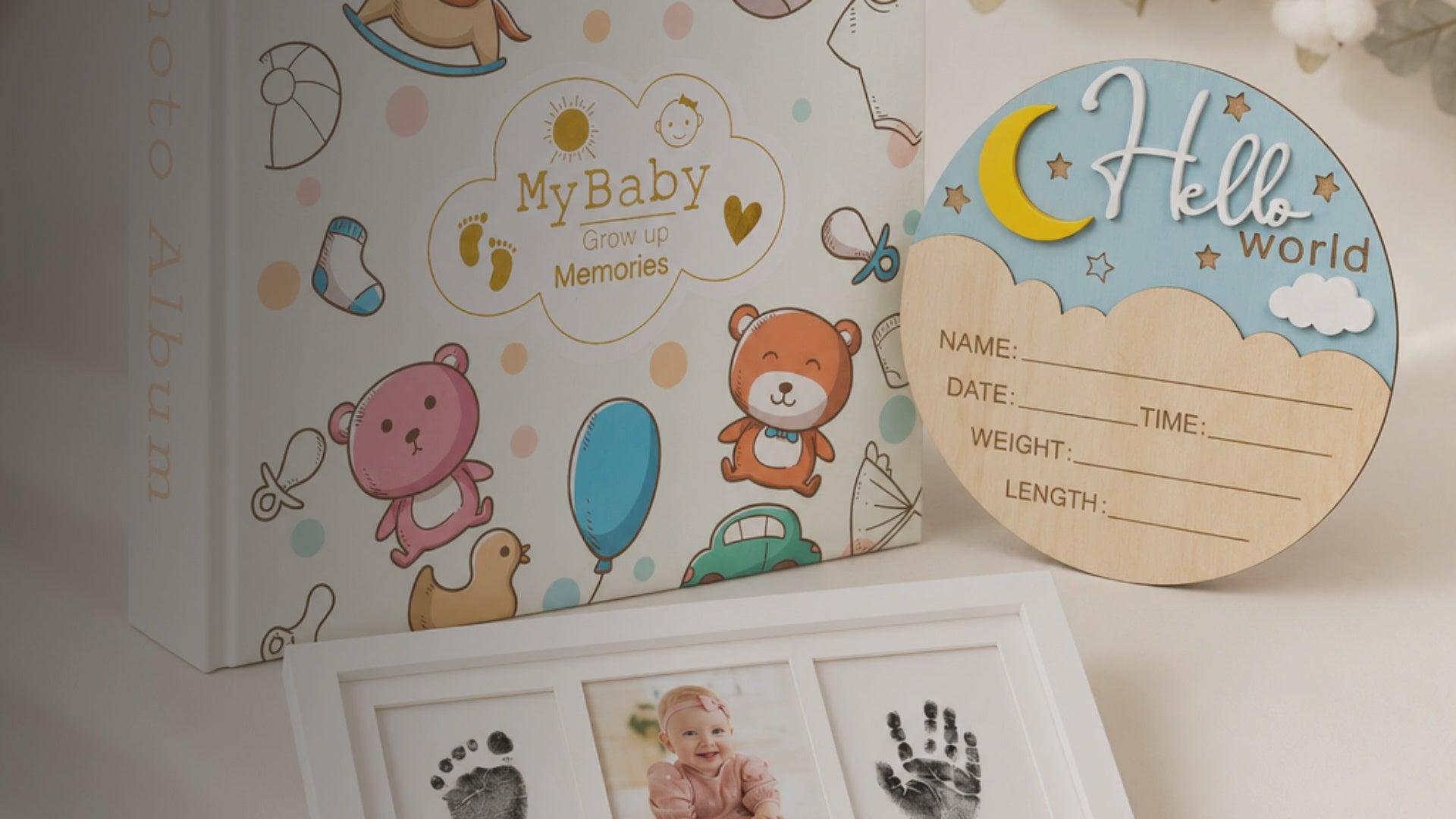 Kiddospot First Memories Gift Set — includes 100-page guided baby memory book and journal with gold foil hardbound cover, newborn mess-free inkless hand and footprint kit, and wooden Hello World birth announcement sign. Complete newborn keepsake bundle, ISO 8124 certified, arrives gift-boxed. Free AU shipping. kiddospot.com
